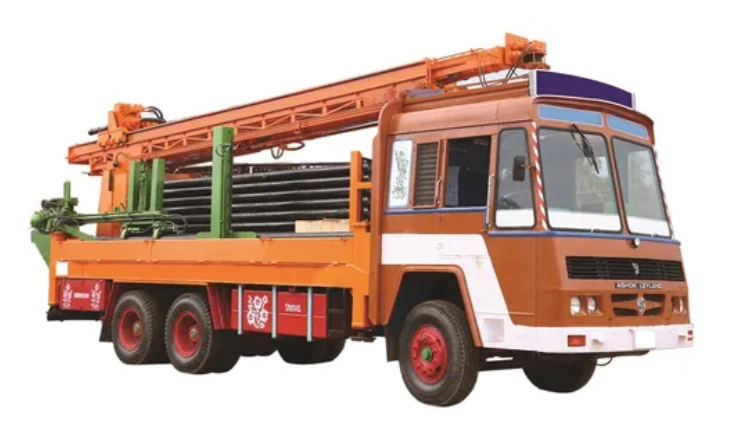 A vehicle with a crane on top, prepared for industrial borewell drilling and cleaning services.